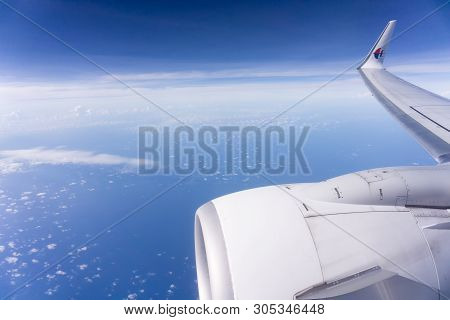 Sabah, Malaysia - May 9 2019; Above The Clouds And Sea In Malaysian Airlines Plane With Corporate In