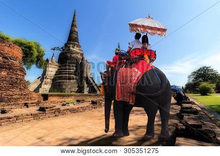 Foreign Tourists Elephant Ride To Visit Ayutthaya, There Are Ruins And Temple In The Ayutthaya Perio