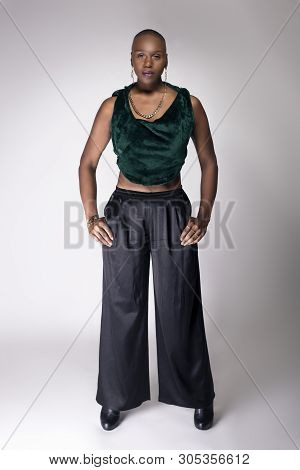 Black African American Female Fashion Model Posing With Trendy Bald Hairstyle And Stylish Clothing I