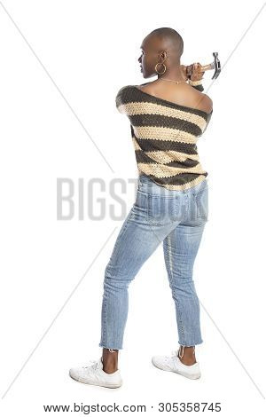 Black African American Female Swinging A Hammer Pretending To Hit Or Smash On A White Background.  S