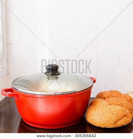 Hot Plate For The Sabbath. Pot With Traditional Food And Challah-special Bread In Jewish Cuisine. Tr
