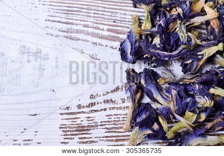Dry Blue Anchan Tea On The White Wooden Board