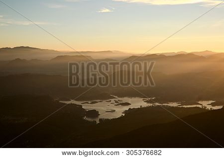 Bright Golden Sunlight In Morning. Horizon Over Mountain Range With Stunning Sunrise Orange Light. M