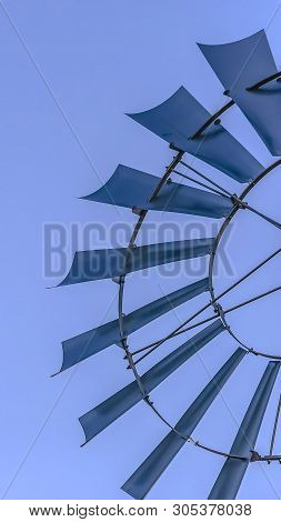 Panorama Close Up Of The Multiple Blades Of A Windpump With Clear Blue Sky Background