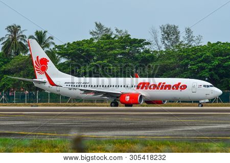 Passenger Airplane Taxiing On Runway Of Airport