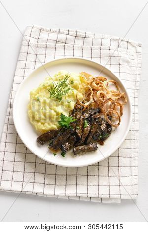 Tasty Roasted Beef Liver With Mashed Potatoes And Fried Onion Rings On White Plate. Pieces Liver (of