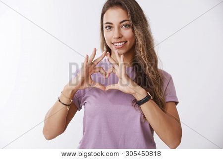 Tender Charming Smiling Young Girl Looking Joyfully Showing Heart Gesture Confessing Love, Heartwarm