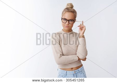 Indoor Shot Of Influental Attractive And Sassy Confident Female Boss In Glasses Rolling Strand Of Bl