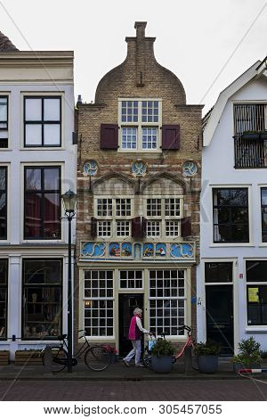 Gouda, Holland, Netherlands, April 23, 2019. The Gouda Old Town, A Street Of Dutch Style Facades Of 