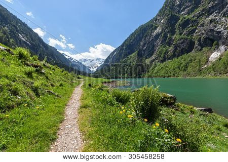 Path Through Spring Mountains Landscape Near Alpine Lake. Stillup, Stillup Lake, Austria, Tyrol