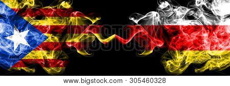 Catalonia Vs South Ossetia Smoke Flags Placed Side By Side. Thick Colored Silky Smoke Flags Of Catal