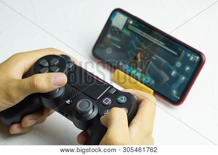 Bishkek, Kyrgyzstan - June 06, 2019: Man Playing Games On Apple Arcade Subscription System On Ios 13