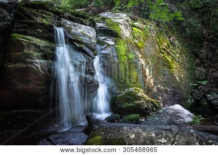 Waterfall With Swimming Hole Along Hiking Trail During Vacation Travel