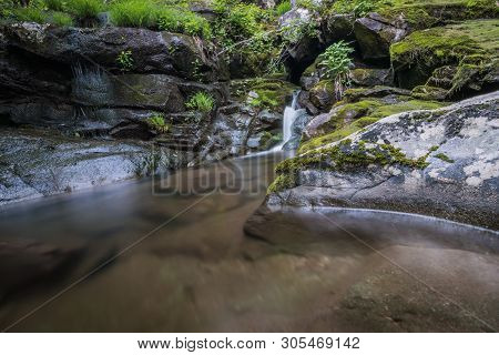 Waterfall With Swimming Hole Along Hiking Trail During Vacation Travel
