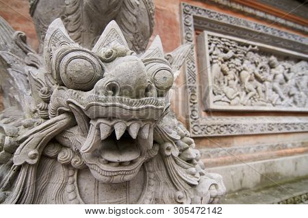 Close Up Picture Of A Typical Balinese Stone Statue That Is Located At The Pura Damel Temple In Ubud