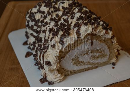 Frosted Cream Cheese Roll Cake With Whipped Frosting And Chocolate Chips