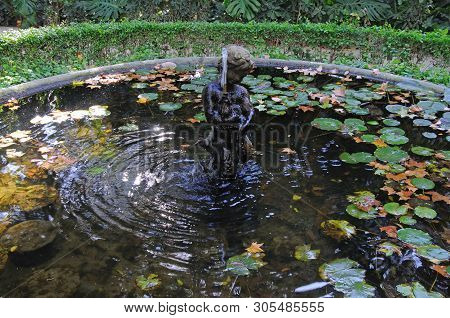 Malaga, Spain - November 4, 2009 - Fountain In The Triton Pond At La Concepcion Historical Botanical