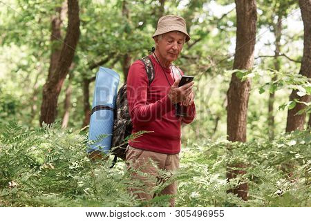 Experienced Traveller Holding His Smartphone In One Hand, Using Device For Orientating, Being Alone,
