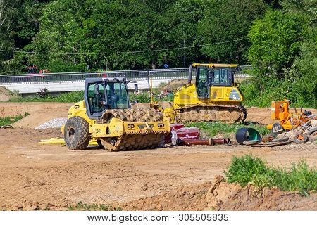 Hanover / Germany - June 2,2019: Yellow Construction Vehicles Stands On A Construction Site In Hanov
