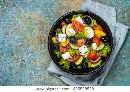Greek Salad. Vegetable Salad From Tomato, Cucumber, Feta Cheese And Olive Oil. Mediterranean Kitchen