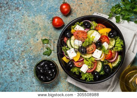 Greek Salad. Vegetable Salad From Tomato, Cucumber, Feta Cheese And Olive Oil. Mediterranean Kitchen