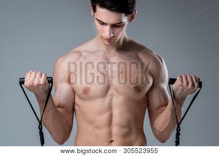 Studio Portrait Young Caucasian Man On Gray Background Posing. Theme Of Puberty, Problem Skin, Teen 