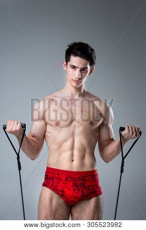 Studio Portrait Young Caucasian Man On Gray Background Posing. Theme Of Puberty, Problem Skin, Teen 