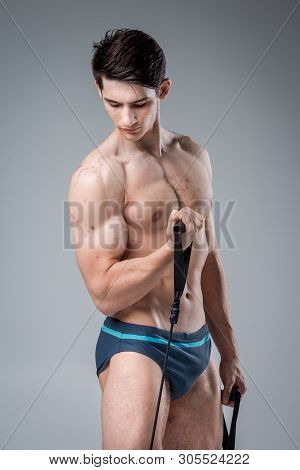 Studio Portrait Young Caucasian Man On Gray Background Posing. Theme Of Puberty, Problem Skin, Teen 