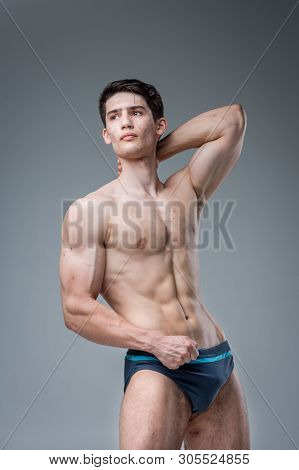 Studio Portrait Young Caucasian Man On Gray Background Posing. Theme Of Puberty, Problem Skin, Teen 