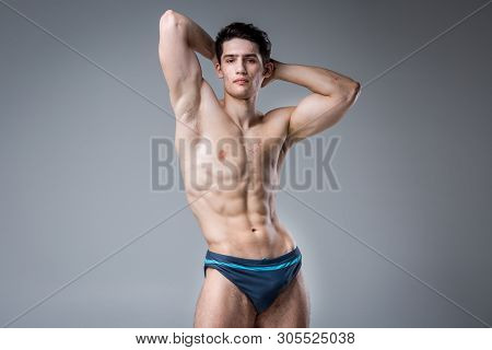 Studio Portrait Young Caucasian Man On Gray Background Posing. Theme Of Puberty, Problem Skin, Teen 