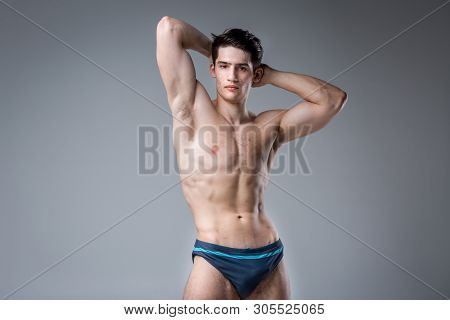 Studio Portrait Young Caucasian Man On Gray Background Posing. Theme Of Puberty, Problem Skin, Teen 