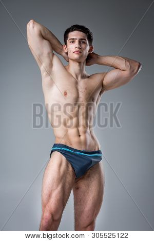 Studio Portrait Young Caucasian Man On Gray Background Posing. Theme Of Puberty, Problem Skin, Teen 