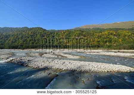 Panorama Of A Mountain River With Stones, Water And Wild Forest In Cherek Gorge In The Mountains Of 
