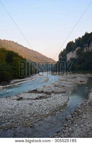 View Of The Evening Fast Mountain River With Stones In The Cherek Gorge In The Mountains Of The Nort