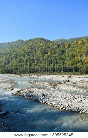 View Of The Fast Mountain River With Stones And Mountains In The Cherek Gorge In The Mountains Of Th