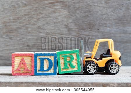 Toy Forklift Hold Letter Block R To Complete Word Adr (abbreviation Of Adverse Drug Reaction) On Woo