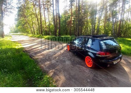 Russia, Moscow - June 01, 2019: Black Volkswagen Golf Mk6 Tuned With Ragtop And Orange Wheels. Stanc