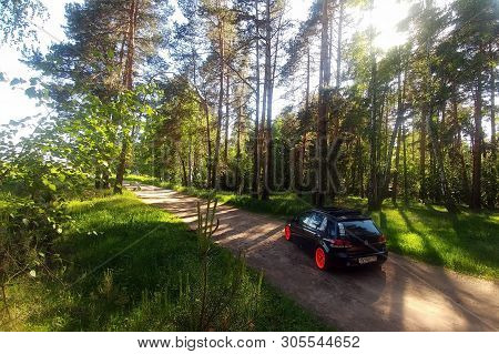 Russia, Moscow - June 01, 2019: Black Volkswagen Golf Mk6 Tuned With Ragtop Soft Roof And Orange Whe