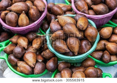 Makassar, Sulawesi, Indonesia - February 28, 2019: Terong Street Market. Closeup Of Green And Purple