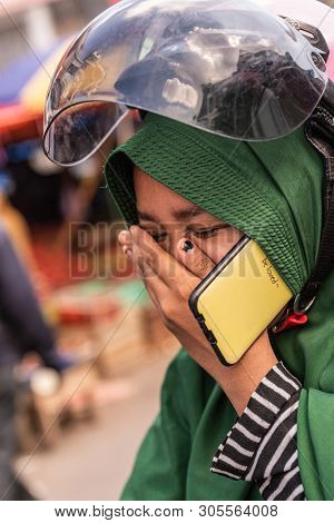 Makassar, Sulawesi, Indonesia - February 28, 2019: Terong Street Market. Closeup Portrait Of Woman W