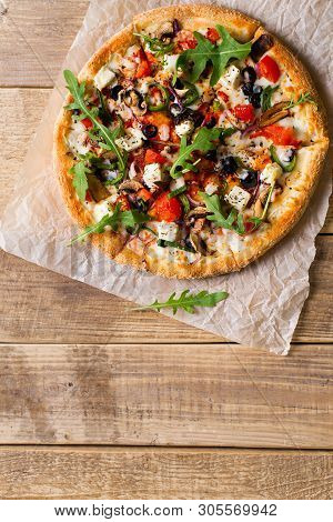Vegetable Italian Pizza With Tomatos On Wodeen Background, Copy Space, Top View, Vertical