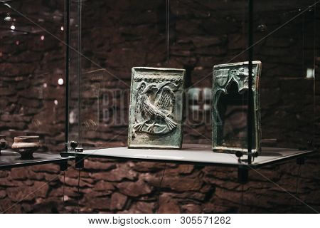 Vianden, Luxembourg - May 18, 2019: Exhibits On Display In A Glass Case Inside Vianden Castle, Luxem