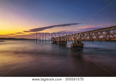 Pier In The Port Of Luderitz At Sunset. Luderitz Is A Harbour Town In The Karas Region Of Southern N