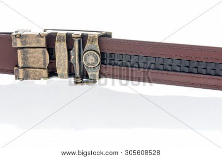 A Belt Witout Belt Holes And Uses Mico Adjustable Ratchet System To Keep The Buckle In Place.