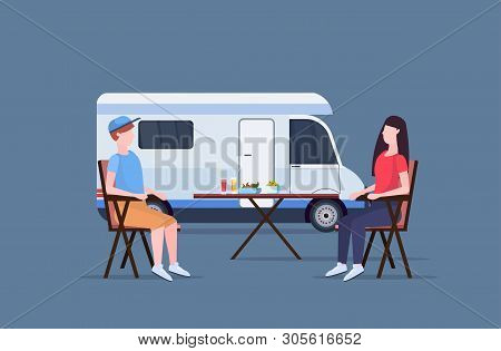 Couple Sitting At Table Near Camping Family Trailer Truck Caravan Car Man Woman Spendingtime Togeher