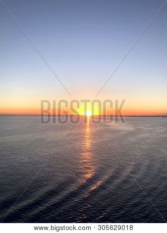 Sunset On The Open Sea. A Look At The Horizon Line During A Sunset On The Sea. Vertical, Open Air, F