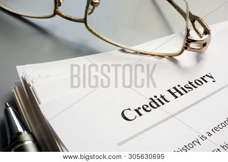 Credit History Report Papers And Pen On Table.
