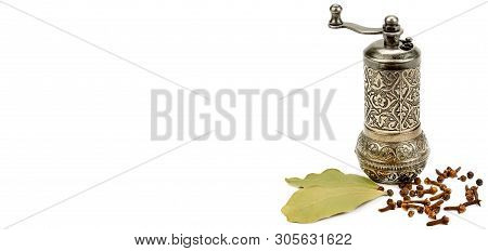 Manual Grinder, Clove Spice And Laurel Isolated On White Background. Wide Photo. Free Space For Text