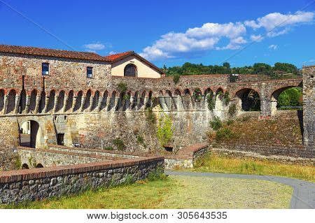 Fortress Firmafede Located On Hill Of Small City Names Sarzana, Italy, Liguria. A Medieval Citadel. 