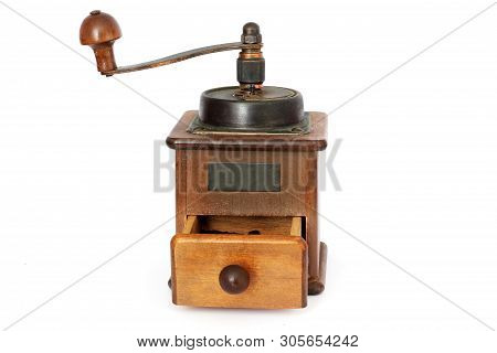 Manual Coffee Grinder On A White Background. Antiquary